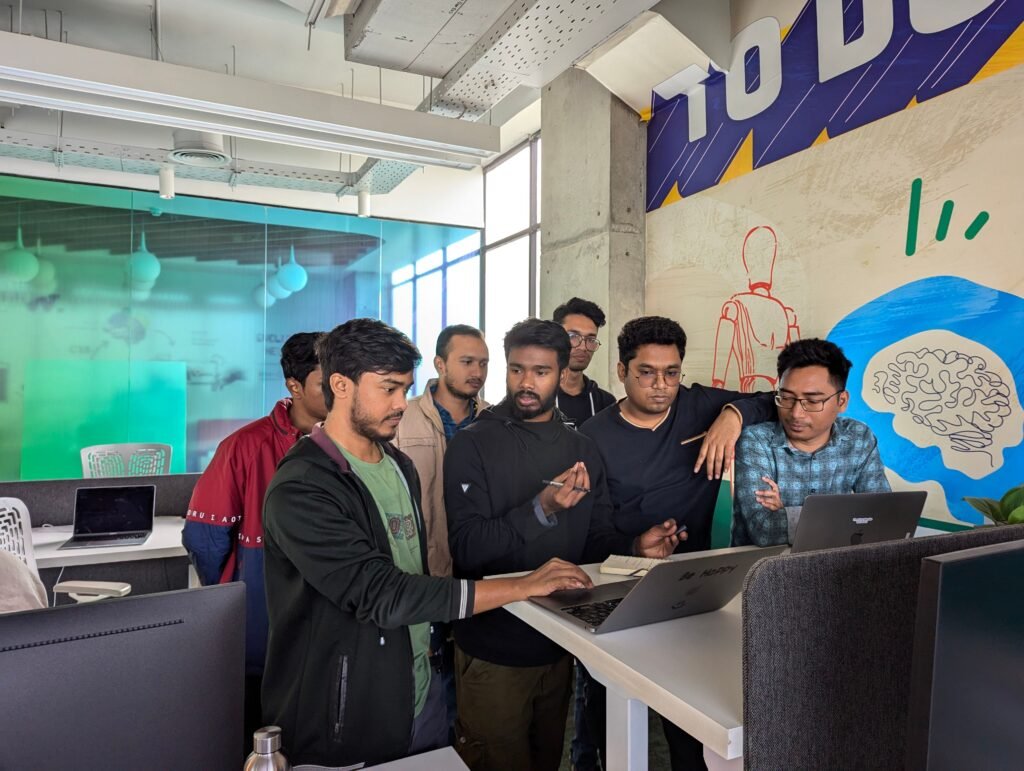 The BeaverBuilderWP team reviewing a website on a laptop